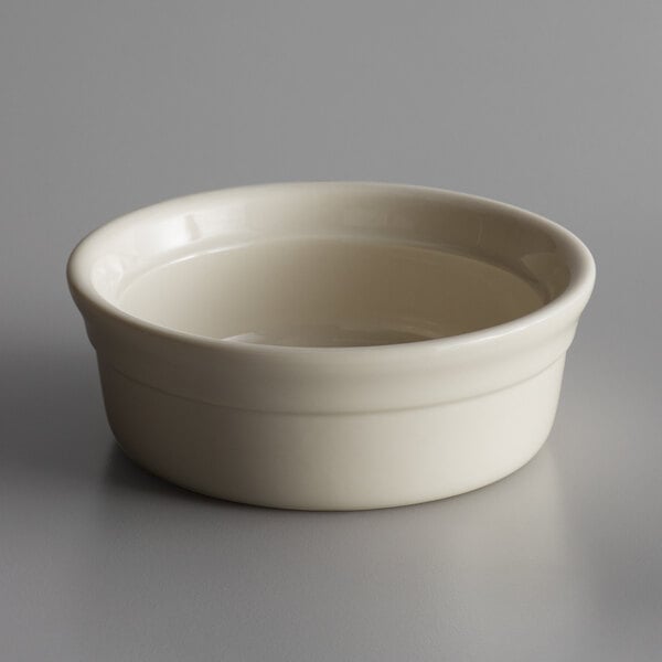 a white bowl on a gray surface