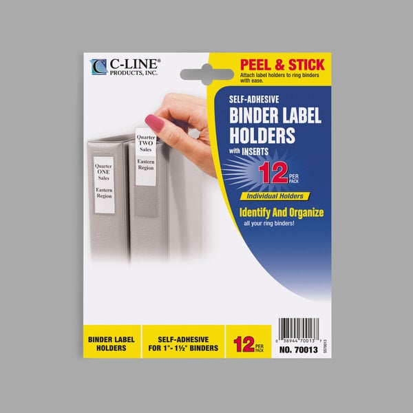 A hand placing a clear C-Line binder label on a binder.