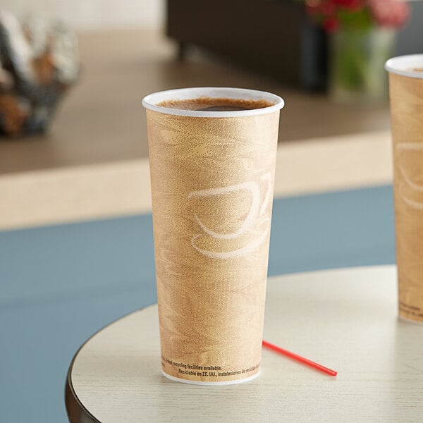 Two Solo Mistique paper hot cups on a table