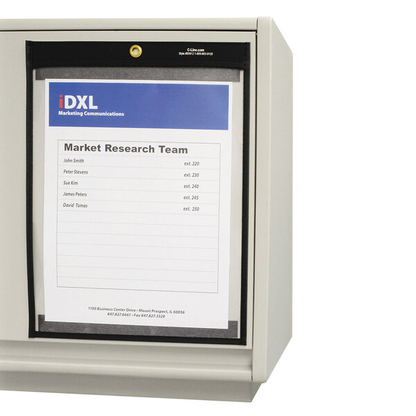 A white box of C-Line clear magnetic shop ticket holders with a paper on it.