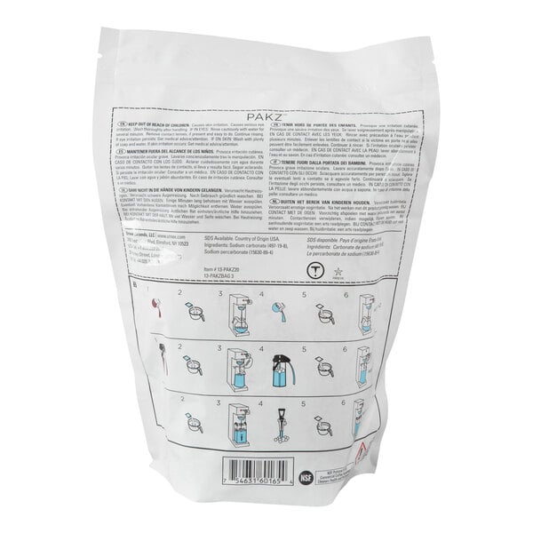 A white resealable bag of Urnex Pakz coffee equipment cleaner packets with instructions and product information printed on the back.