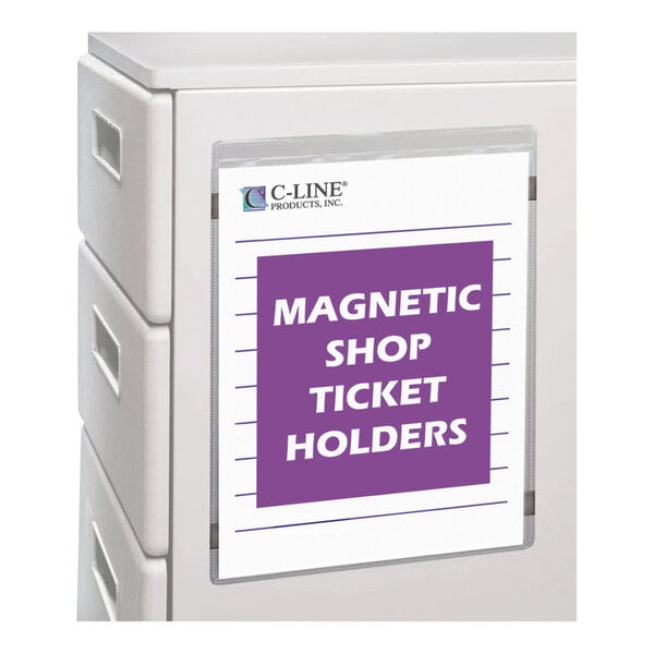 A clear magnetic holder displaying a sign labeled 'MAGNETIC SHOP TICKET HOLDERS' is attached to the side of a light-colored cabinet or drawer unit.