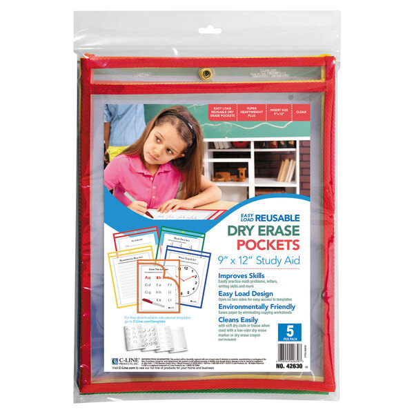 A girl in a pink shirt using a C-Line Easy-Load Reusable Dry Erase Pocket with a child's name written on it.
