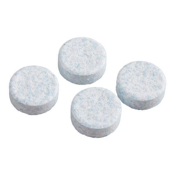 A set of four round, light blue cleaning tablets for tea equipment.