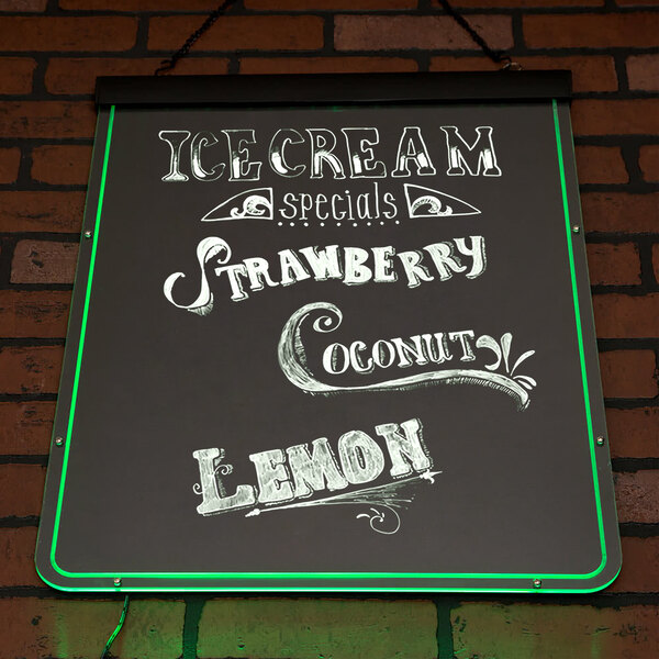 A white Aarco lighted markerboard with white text that reads "Ice Cream, Strawberry, Lemon and Coconut" on a black background.