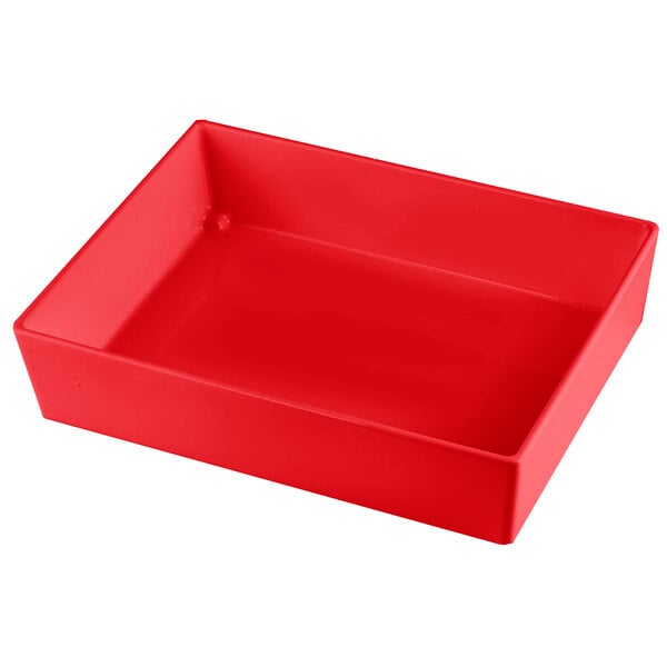 A Tablecraft red cast aluminum rectangular bowl on a table.