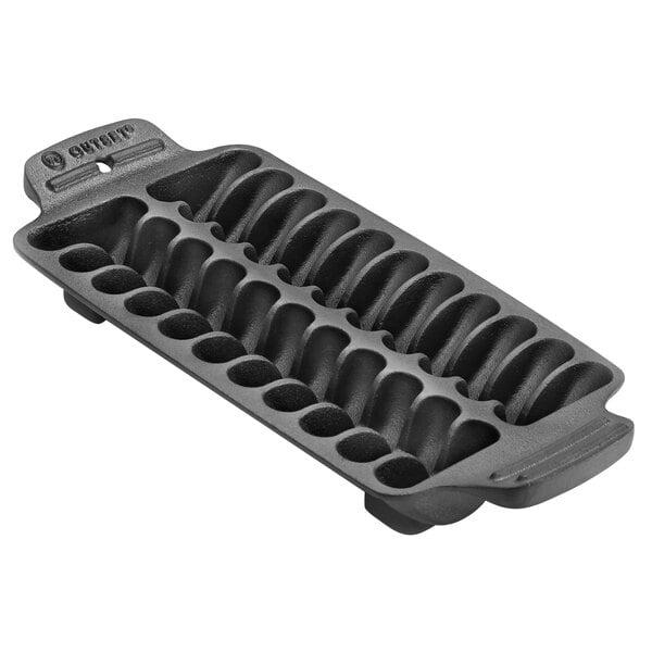 A black cast iron Outset Shrimp Grill Pan with six holes.