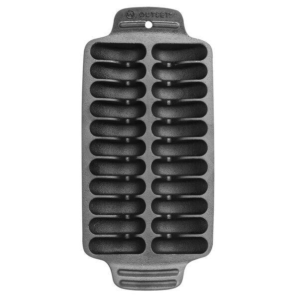An Outset cast iron shrimp grill pan with six compartments.