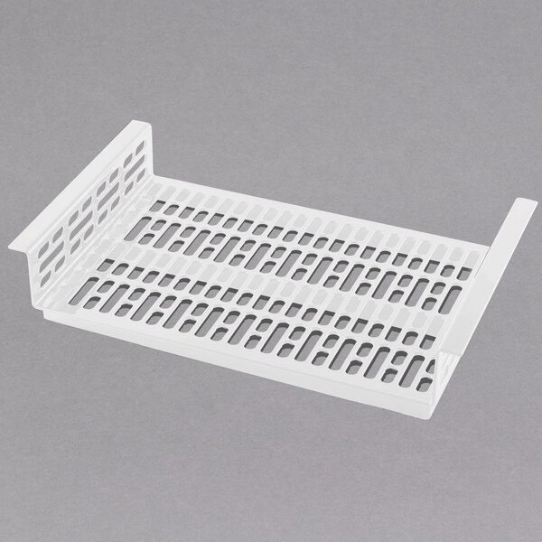 A white plastic tray with a white plastic mesh with holes.