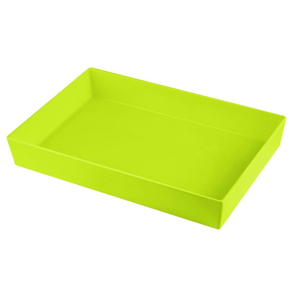 A lime green rectangular cast aluminum bowl on a table.