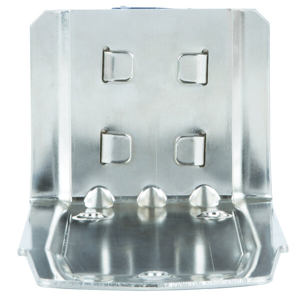 A metal plate with four holes and screws.