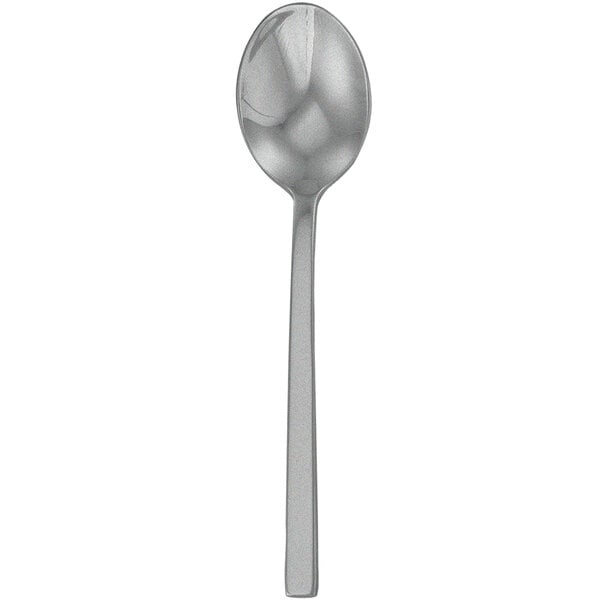 A Walco Fieldstone Finish stainless steel tea spoon with a long thin handle on a white background.