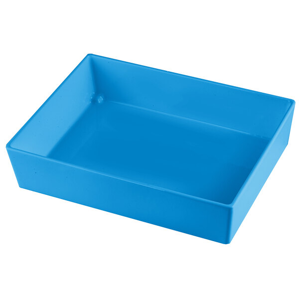 A Tablecraft sky blue cast aluminum bowl with straight sides on a table in a salad bar.
