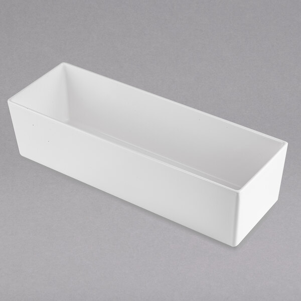 A white rectangular container on a gray surface.