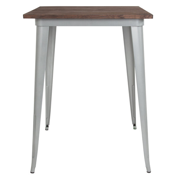 A Flash Furniture bar height table with a wood top and silver metal frame.