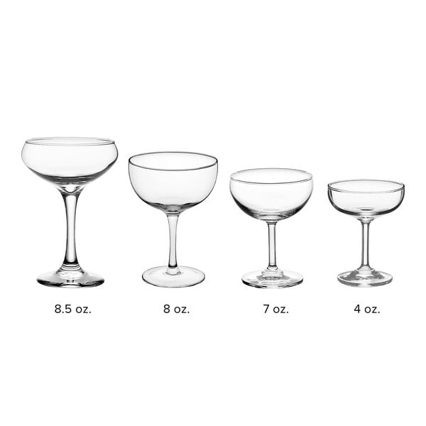 A row of clear Acopa Deco coupe wine glasses with stems.