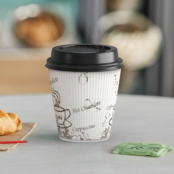 A Choice bean print paper hot cup with a lid and coffee on a table.