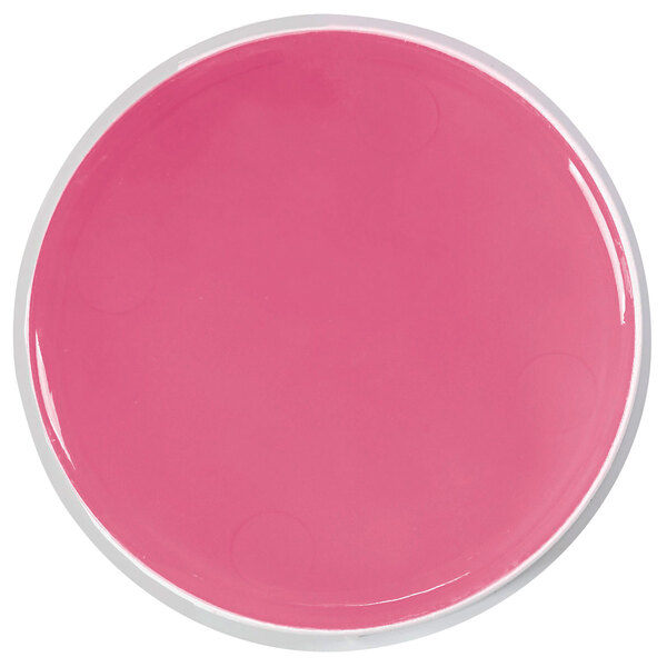 A pink circle of LEE Sortwik fingertip moistener.