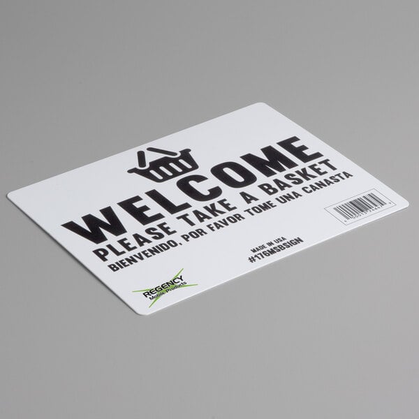 A white rectangular sign with black text that says "Welcome to Regency"