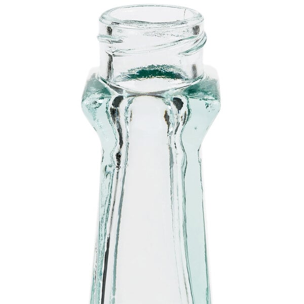 A close-up of a clear glass Tablecraft salt and pepper shaker with a clear cap.