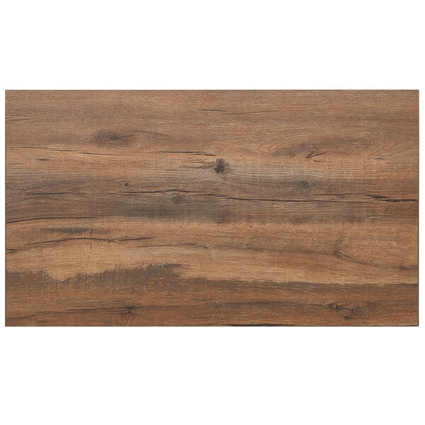 A BFM Seating Relic Knotty Pine rectangular table top with a wood grain and cracks.