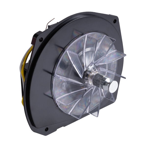 A close-up of a black fan with clear plastic cover for a Lavex 12" Upright Vacuum motor.