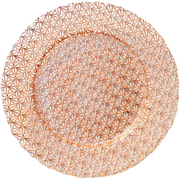 A Bon Chef rose gold glass charger plate with a geometric pattern.