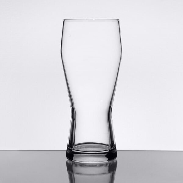 A Libbey customizable pilsner glass on a table with a white background.