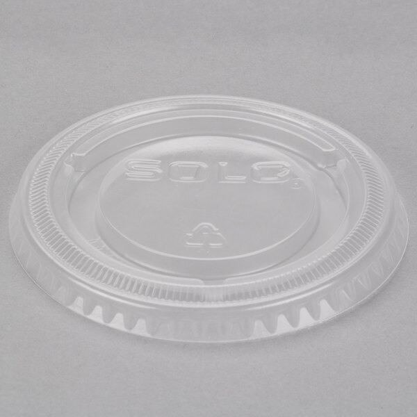 A clear plastic Solo Snaptight lid on a white background.