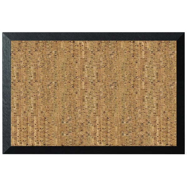 A MasterVision cork bulletin board with a black wood frame on a wall.