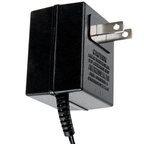 A black Taylor power adapter with a cord.