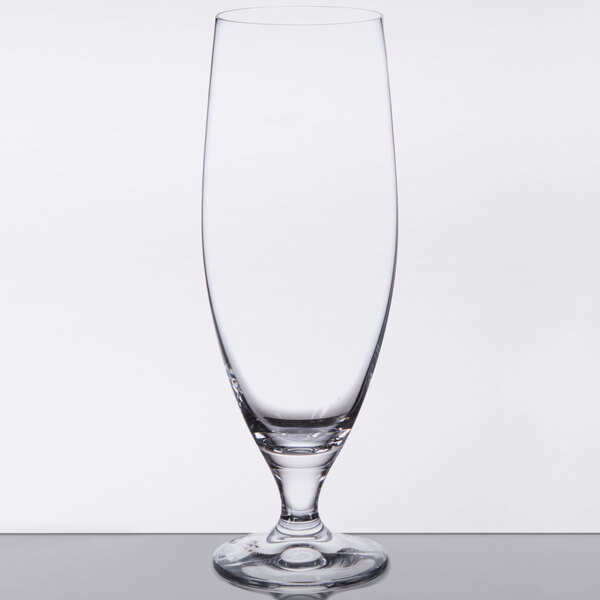 A close-up of a Stolzle Imperial stemmed beer glass with a clear rim and small base.