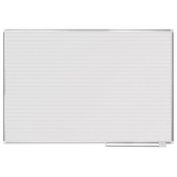 A MasterVision white board with ruled lines.