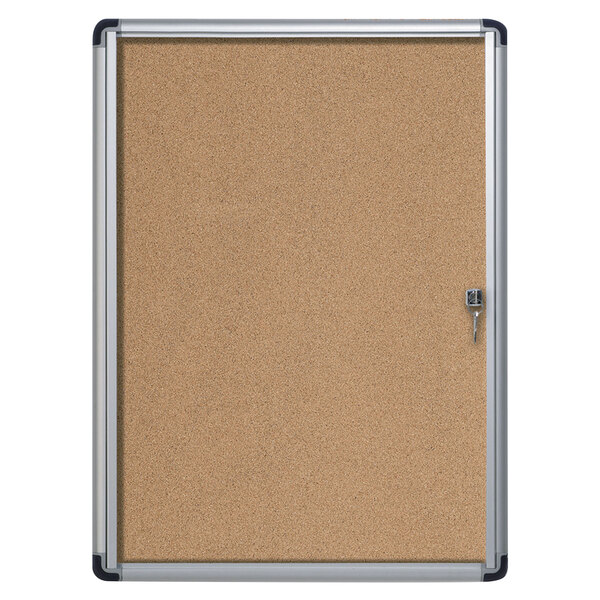 A MasterVision cork bulletin board with an aluminum frame and key lock.