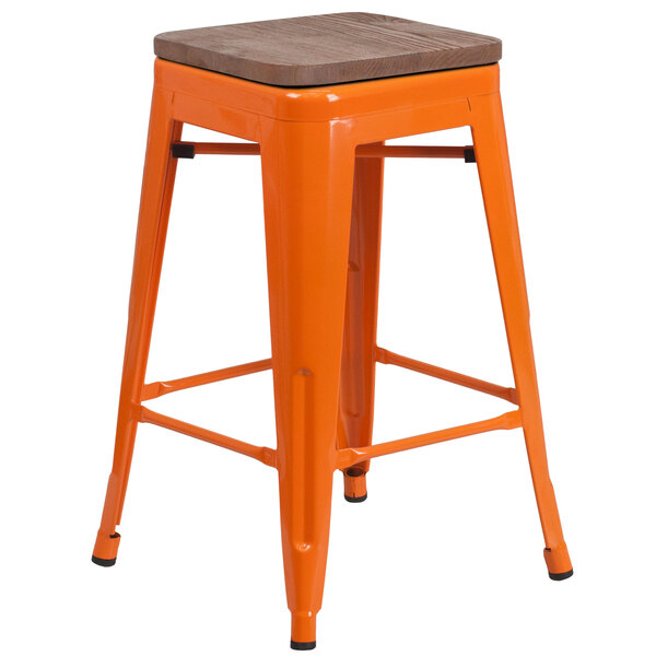 an orange stool with a cushion