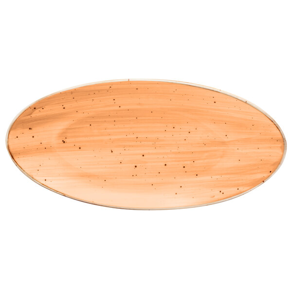An oval maize orange china plate with a hole in the middle.
