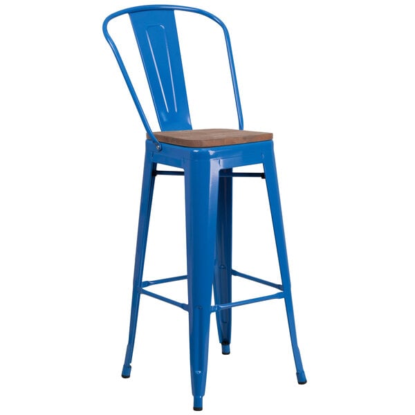 A blue bar stool with a wooden seat.