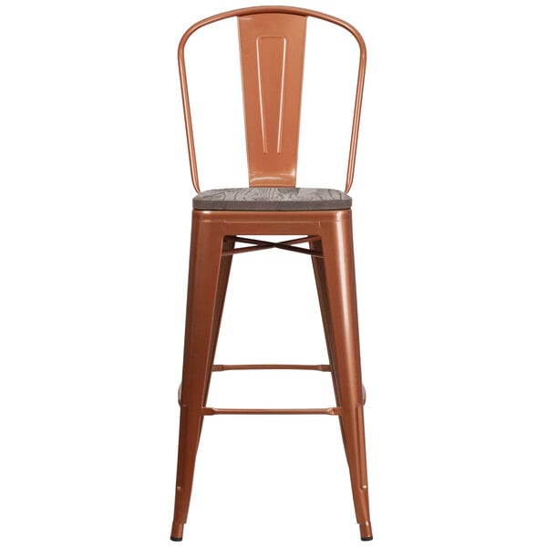 A Flash Furniture copper metal bar stool with a wooden seat.