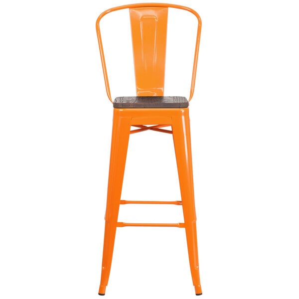 an orange chair with a wooden seat