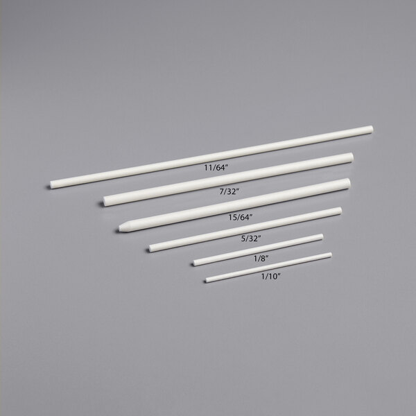 A group of white Paper Lollipop Sticks with measurements and numbers.