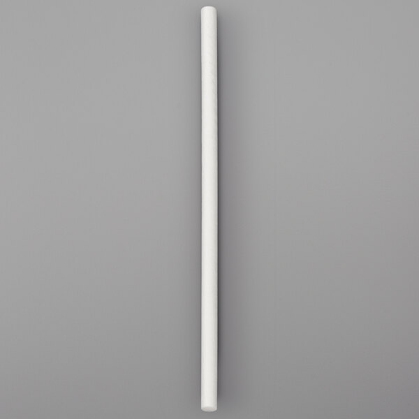 A white paper stick on a gray surface.