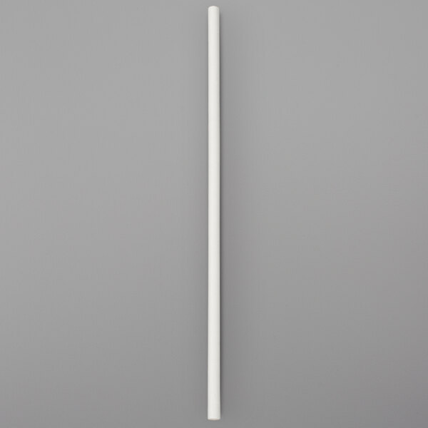 A white paper chocolate stick on a gray background.