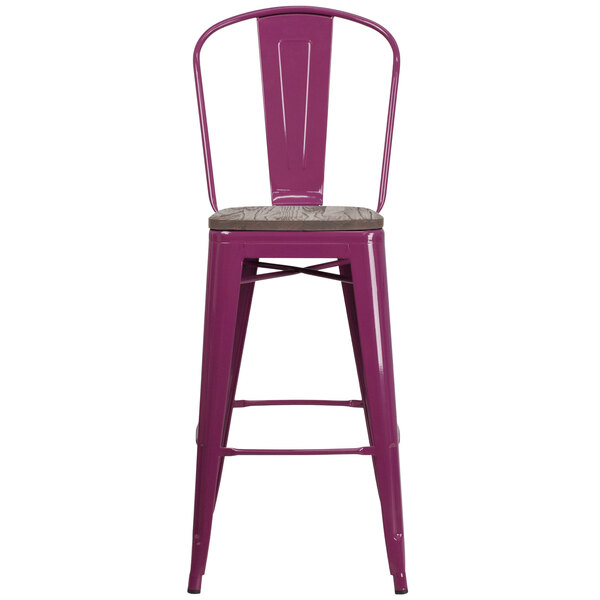 A purple metal bar stool with a wooden seat.