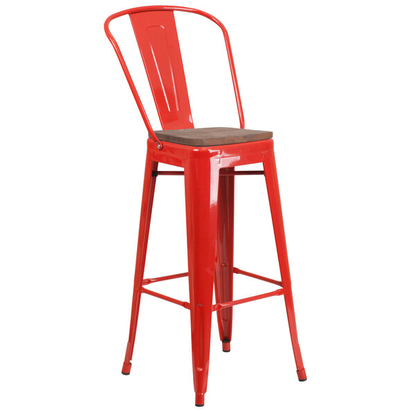 a red metal bar stool