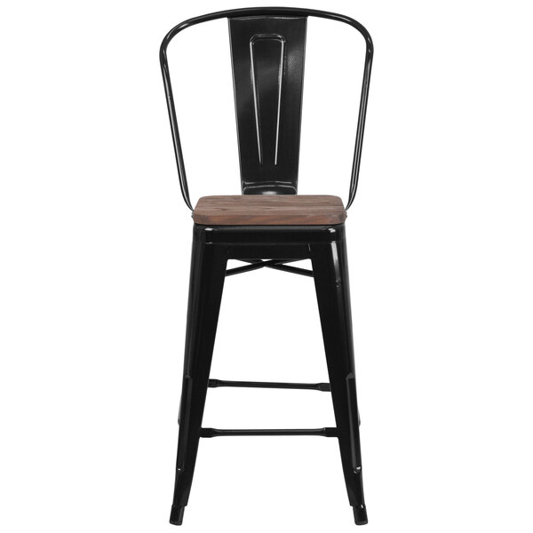 A Flash Furniture black metal counter height stool with a wood seat.