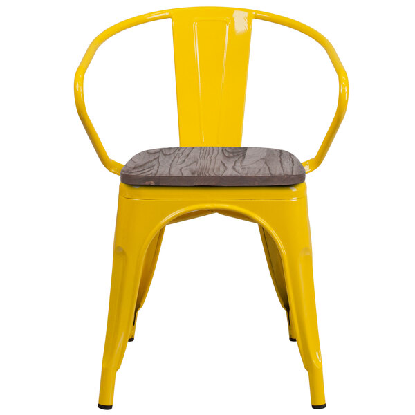 A yellow Flash Furniture metal restaurant chair with a wood seat and arms.