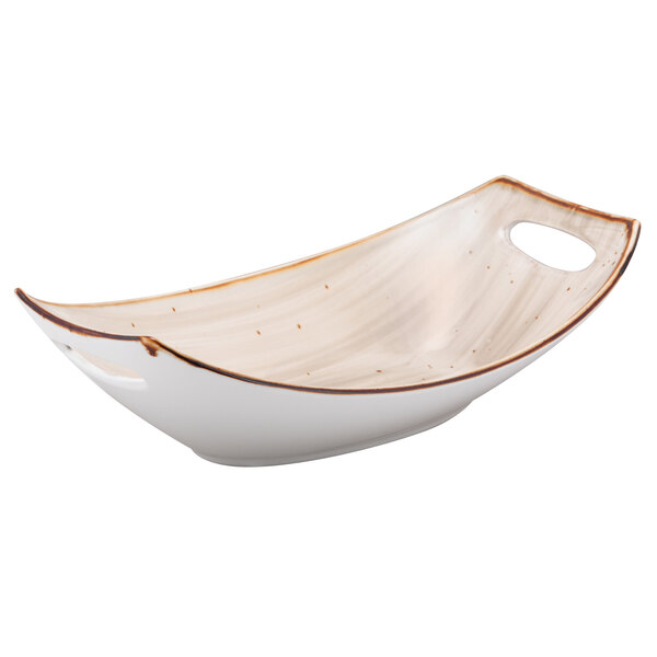 A white bowl with brown specks.