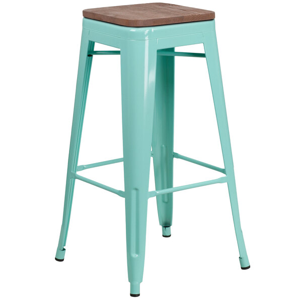 A Flash Furniture mint green bar stool with a wooden seat.