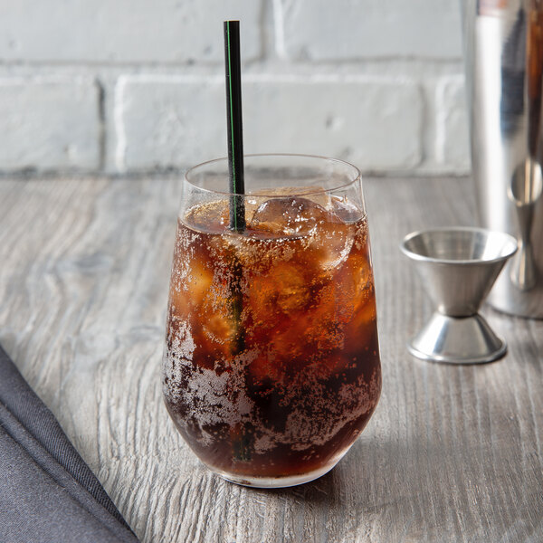 A glass of iced coffee with a black Eco-Products compostable plastic straw.