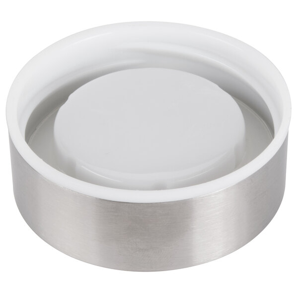 A white circular metal Libbey bottle lid.